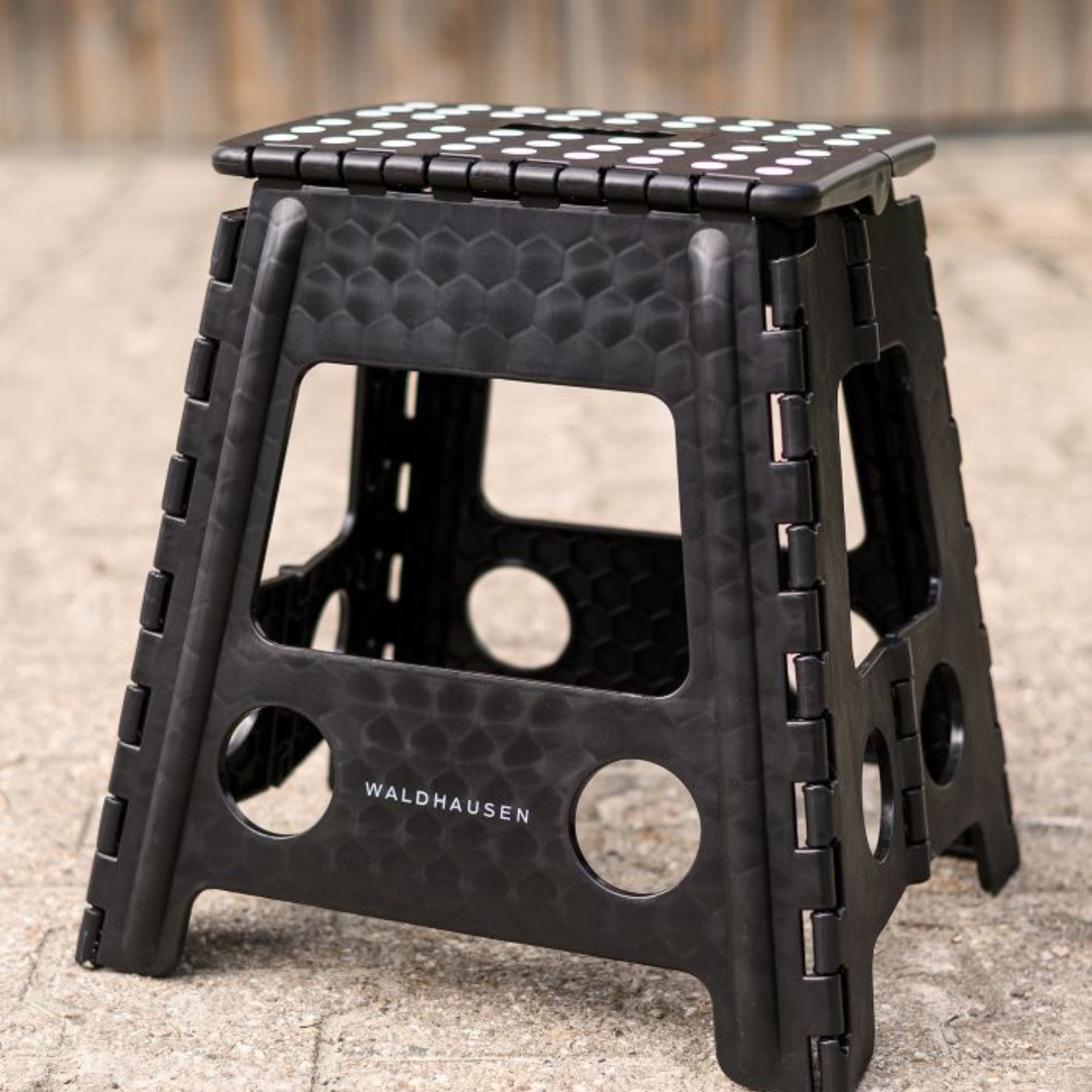 folding stool, black stool, plastic stool, non-slip texture, holes pattern
