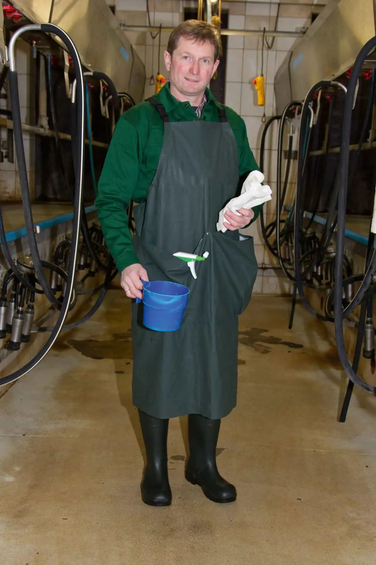 Kerbl Premium Milking Apron with Pockets, Waterproof, in use, in the stable