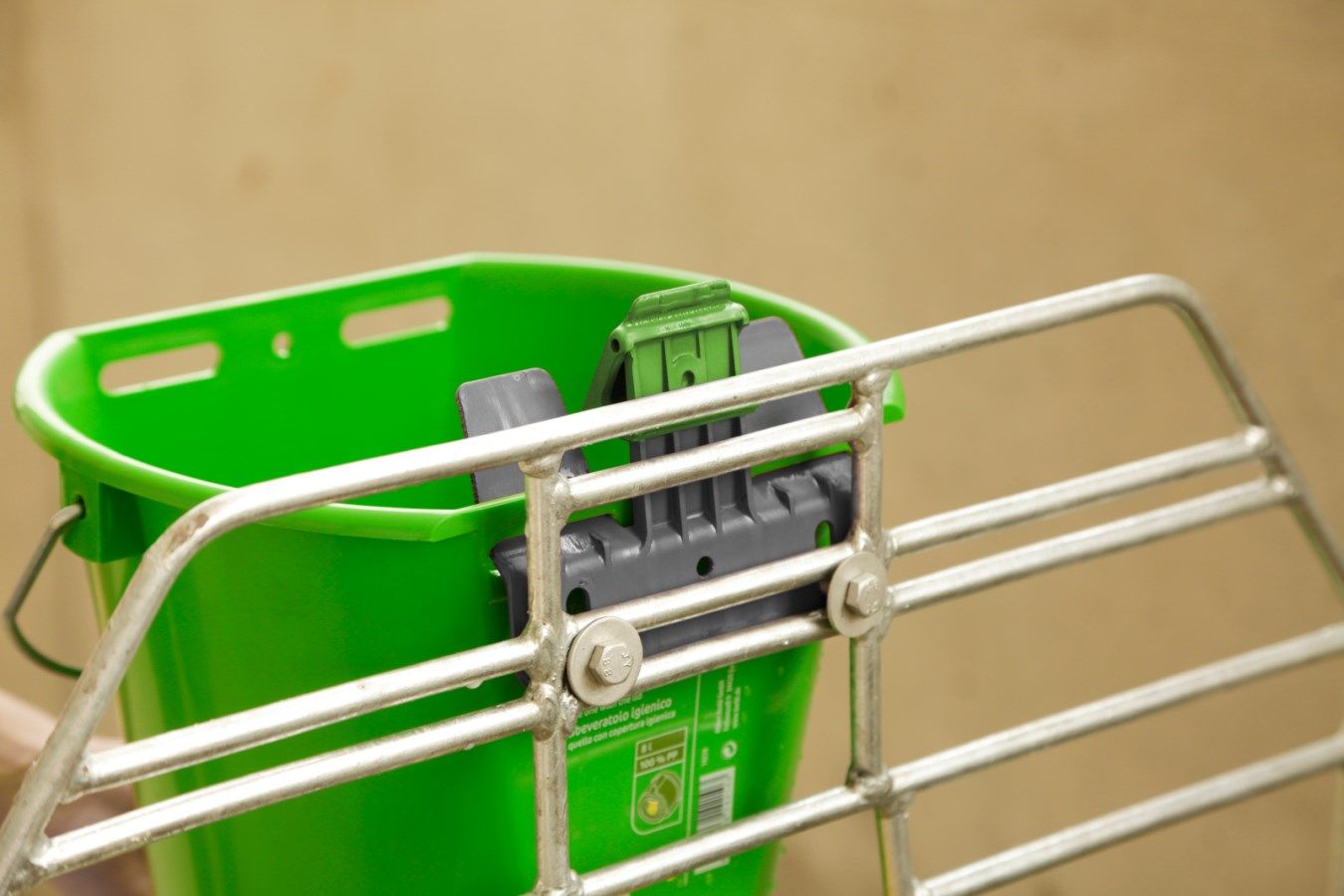 green bucket, plastic bucket, gray attachment, metal basket, cart accessory