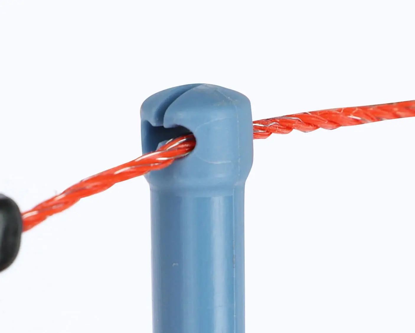 Blue plastic post with orange tape for electric fencing
