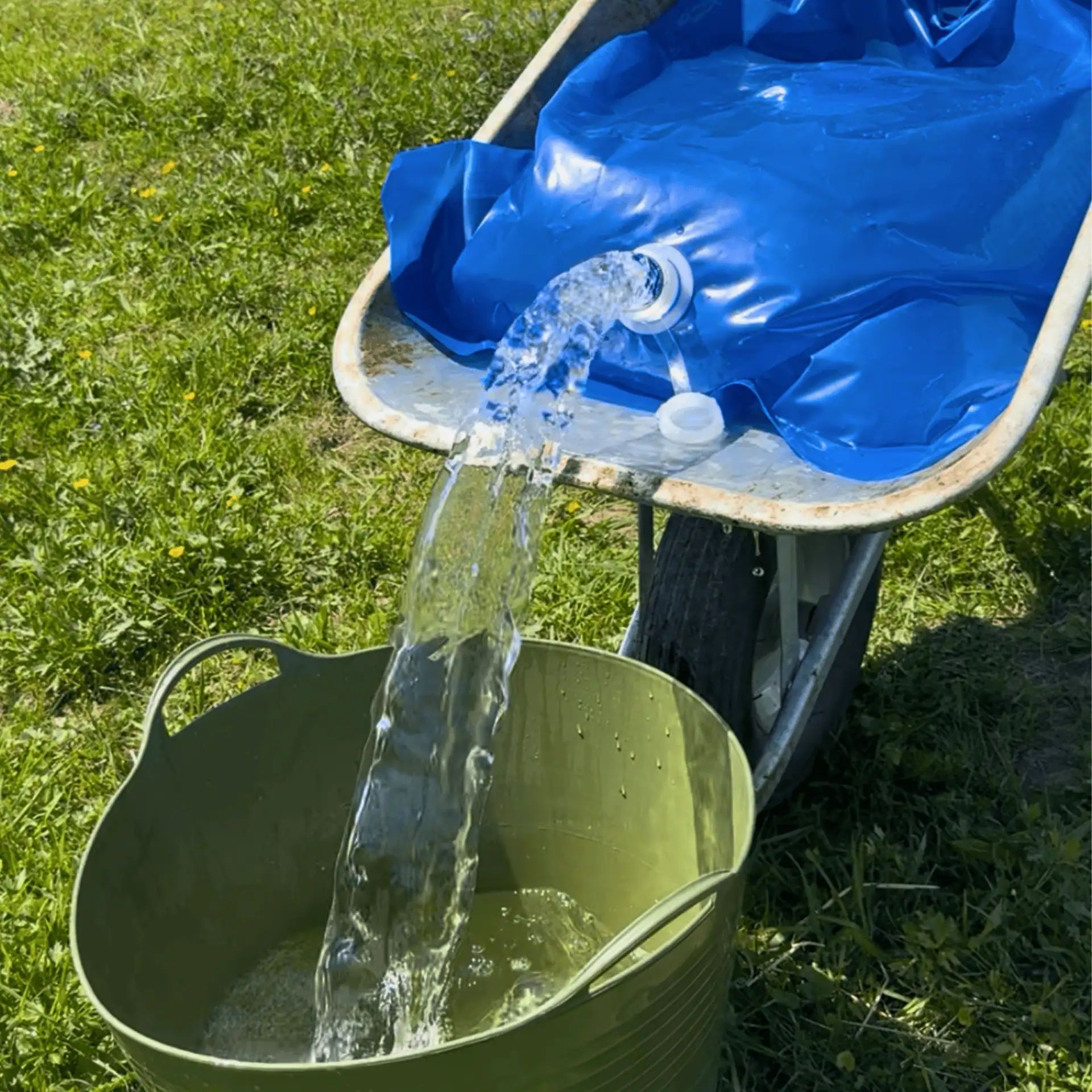 Kerbl H2GoBag Water Container for Wheelbarrows, 80 Litres, in use