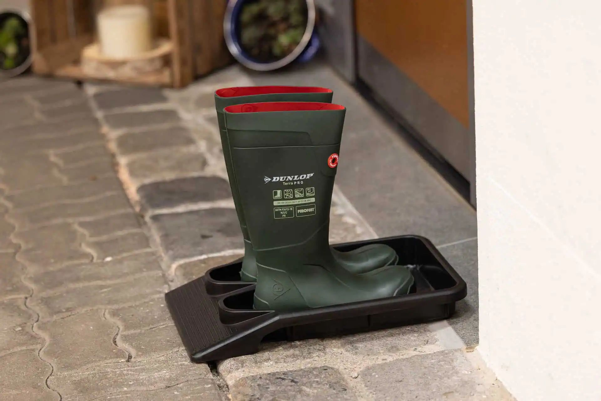 Kerbl EasyOut Boot & Shoe Removal Tray, 1 Pair, Hands-Free Use, in use
