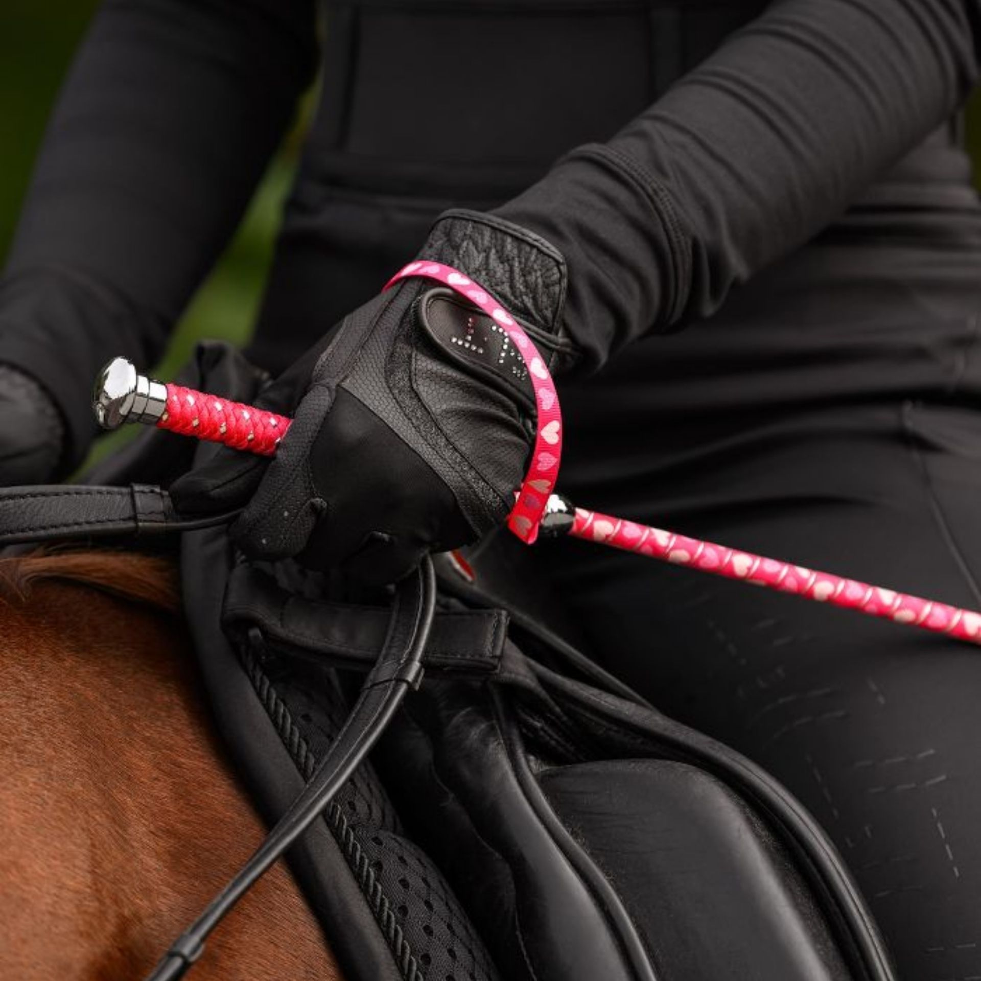 Waldhausen Hearts Children's Dressage Whip, pink, 90 cm, in use, held in hand
