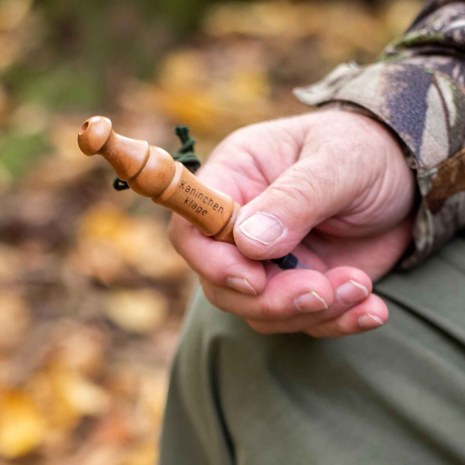 Weisskirchen Rabbit Distress Call, in use, held in hand