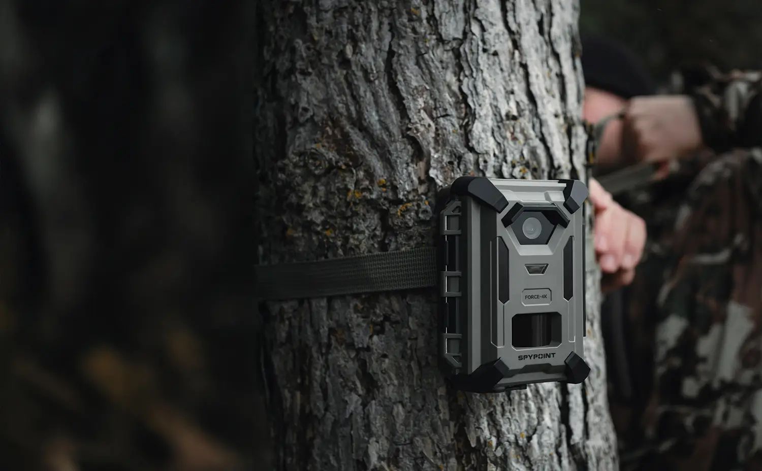 SPYPOINT FORCE-4K trail camera, being set up on a tree