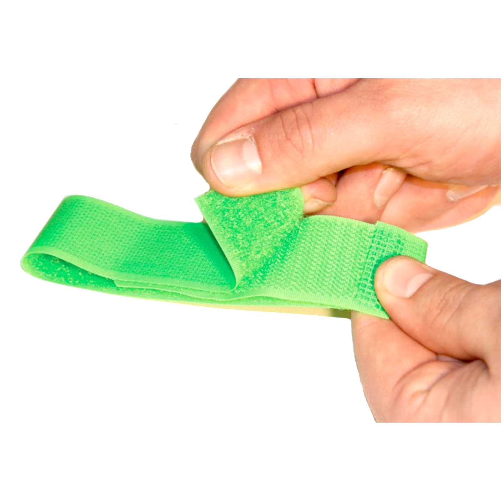 Kerbl Cow Marking Legbands 36 cm Green, Pack of 10, in use, held in hand