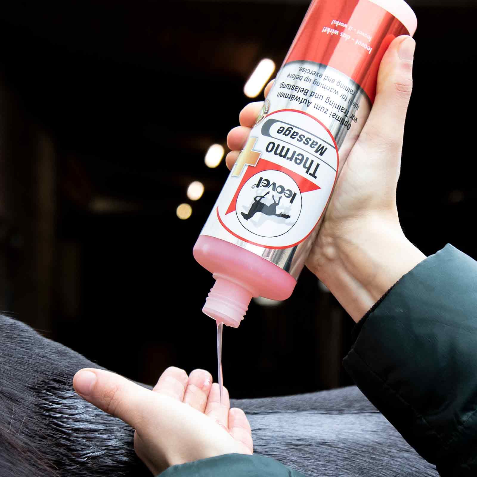 Leovet Thermo-Massage Gel for Horses, warming & circulation-boosting, 500 ml, in use, held in hand