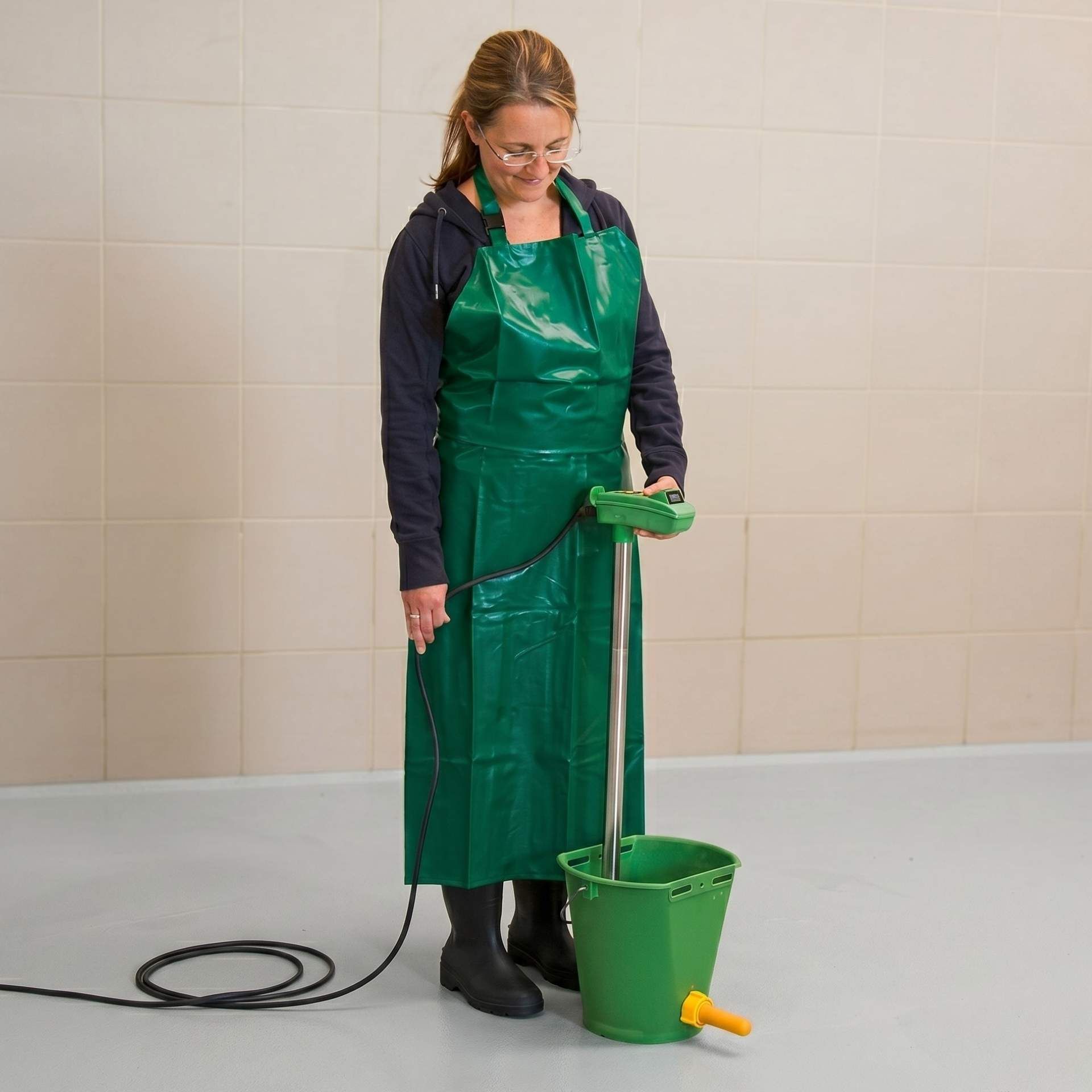 mop, mop bucket, green apron, floor cleaning, safety footwear