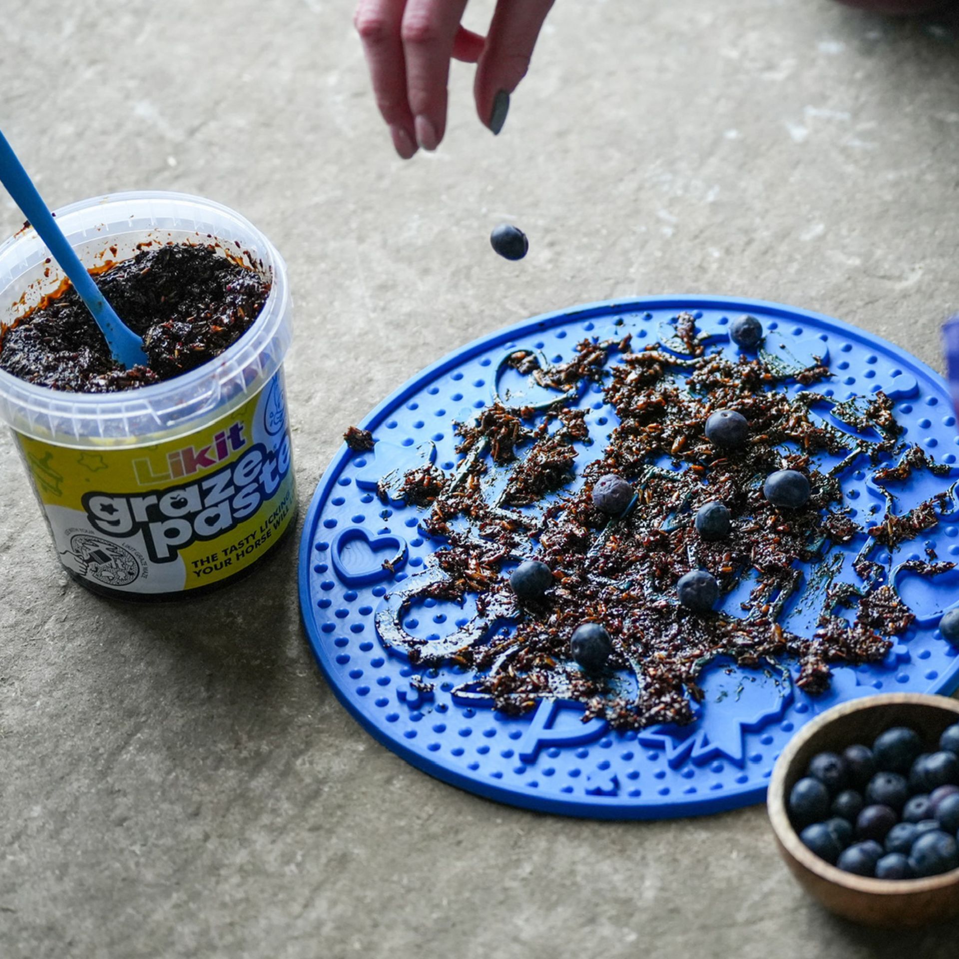 frozen treat, blue silicone mat, blueberries, crumbled topping, jar container
