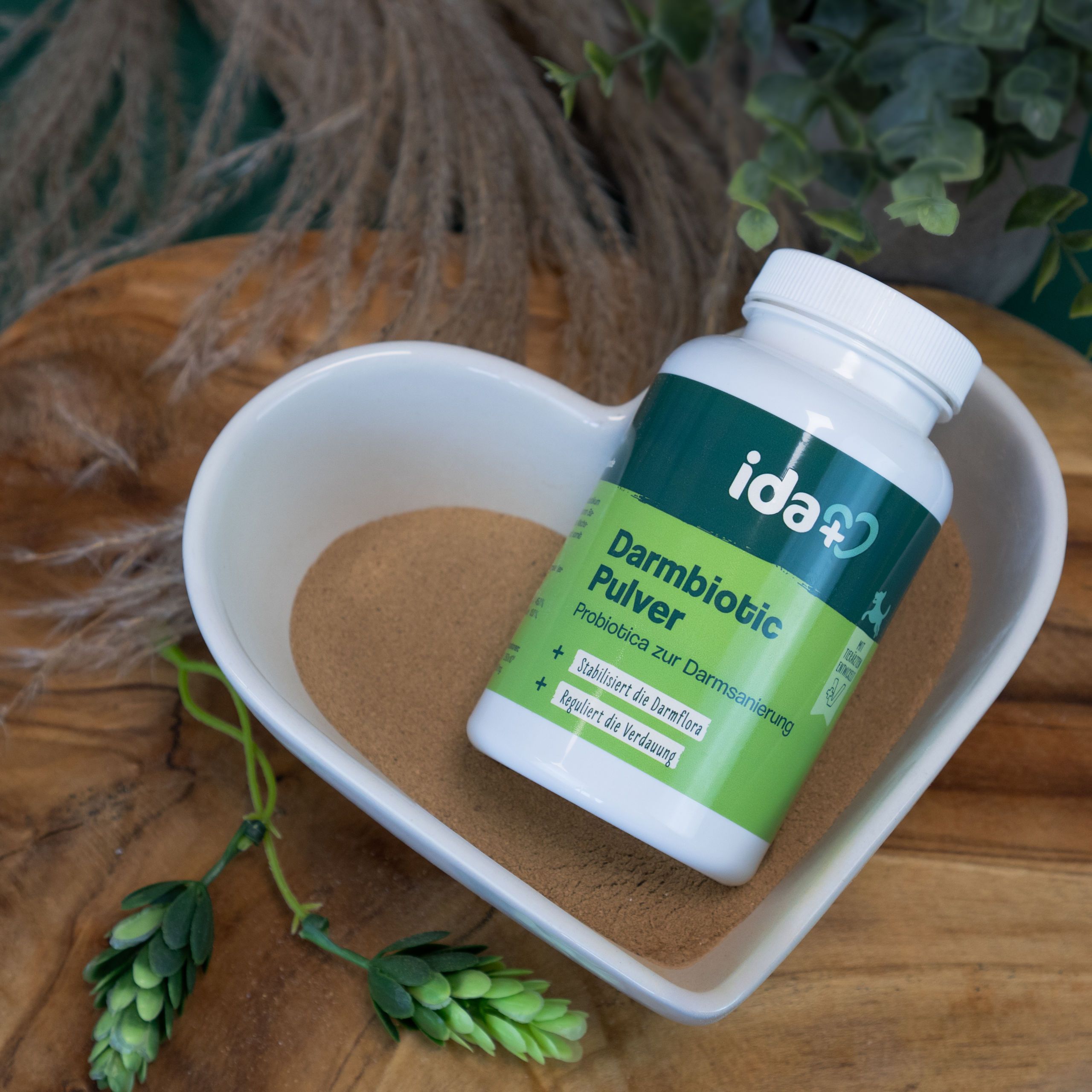 probiotic powder, intestinal health, digestive supplement, green bottle, bowl with powder