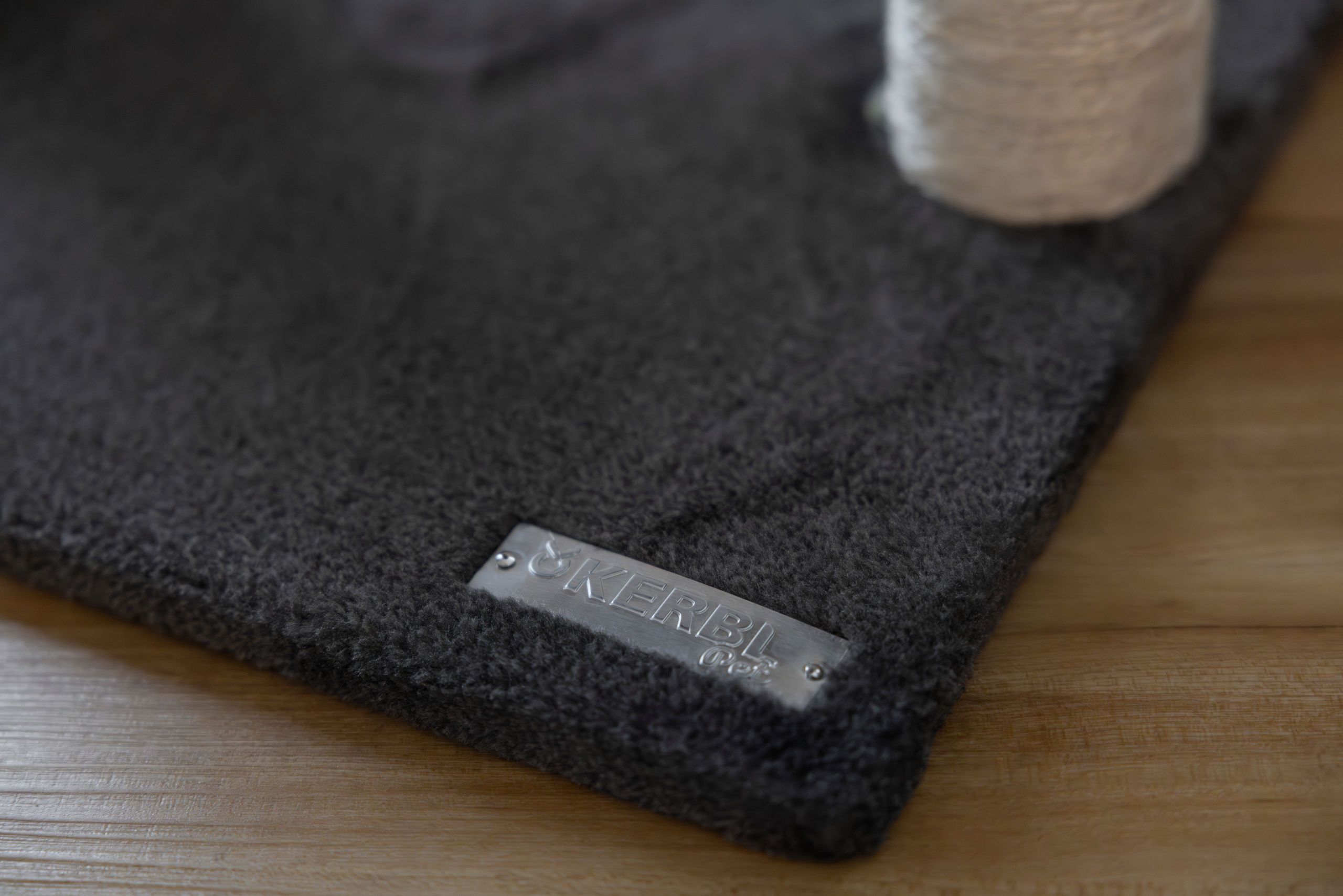 rug, doormat, gray, textured, metal label