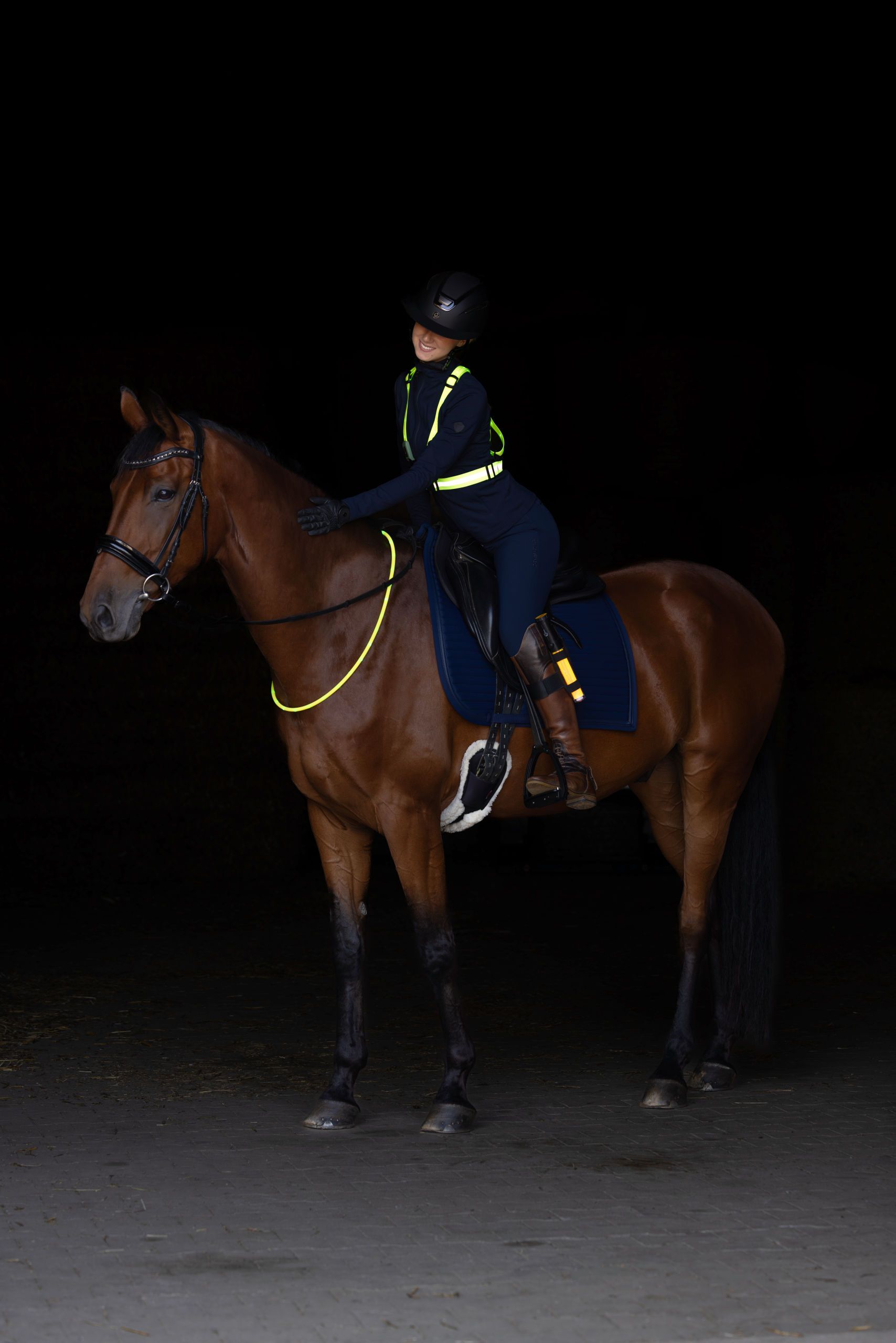 horse rider, equestrian, riding gear, helmet, neon reflective vest