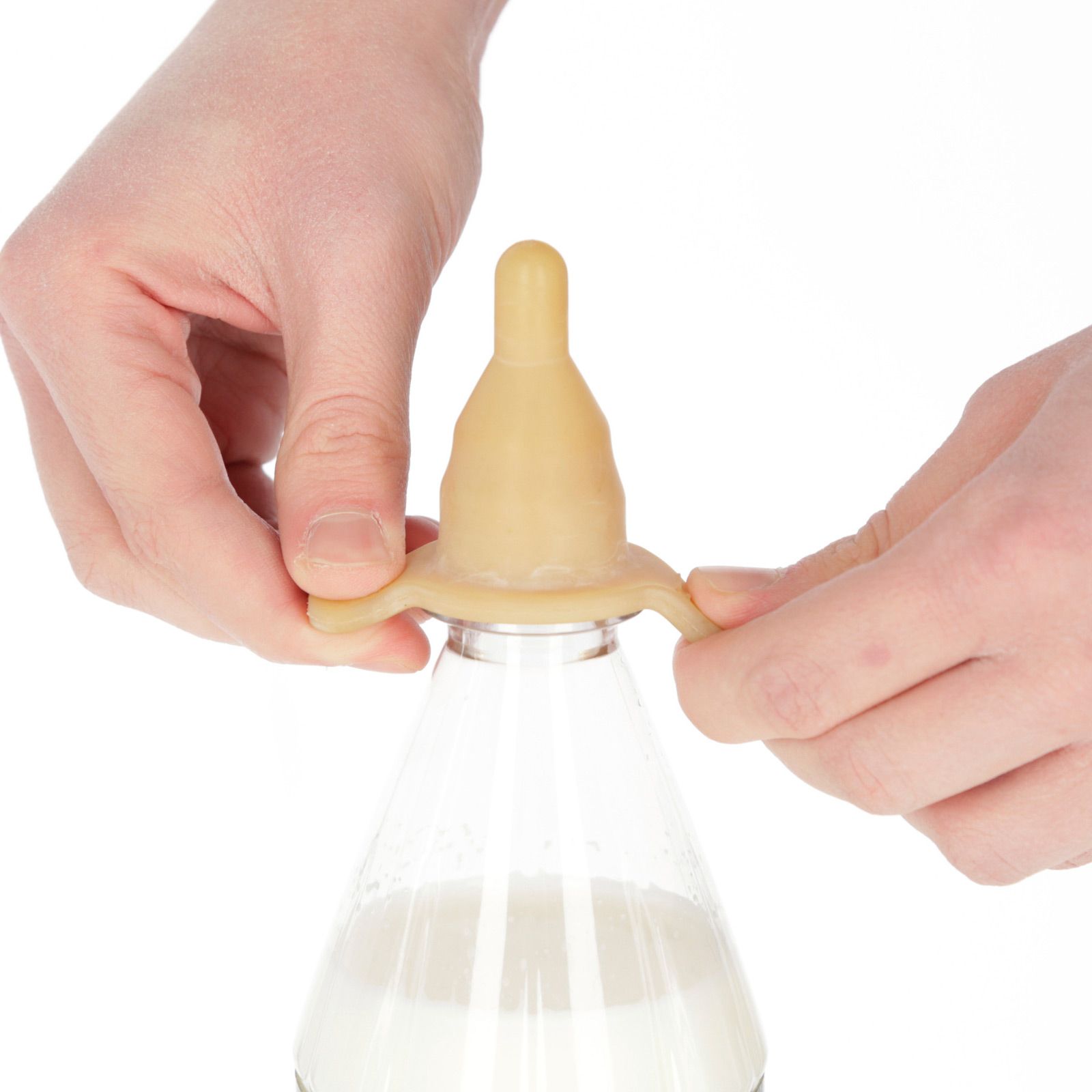 10x Kerbl Rubber Bottle Teat for Lambs, in use, held in hand