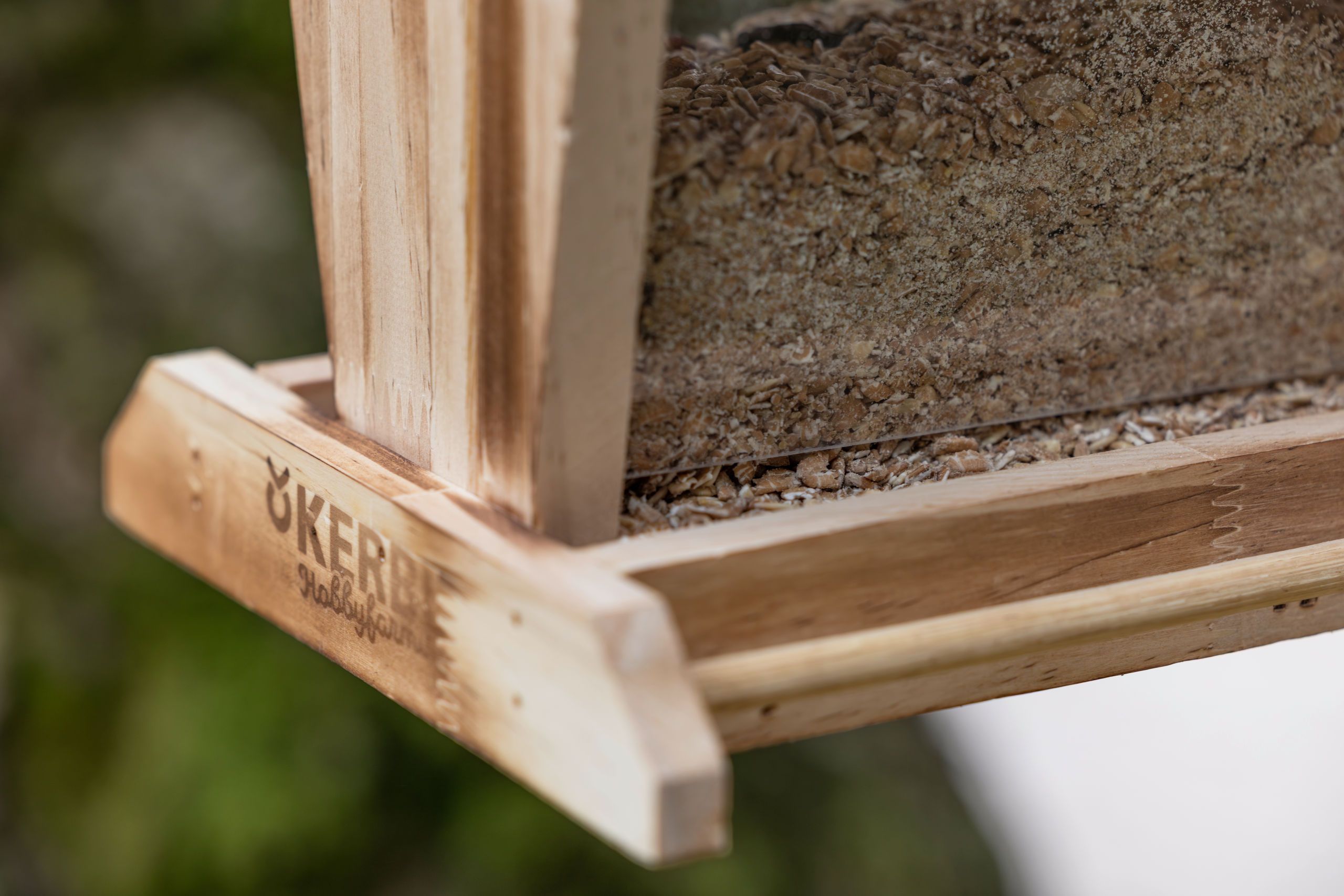 wooden feeder, bird feeder, mesh tray, grains, natural wood